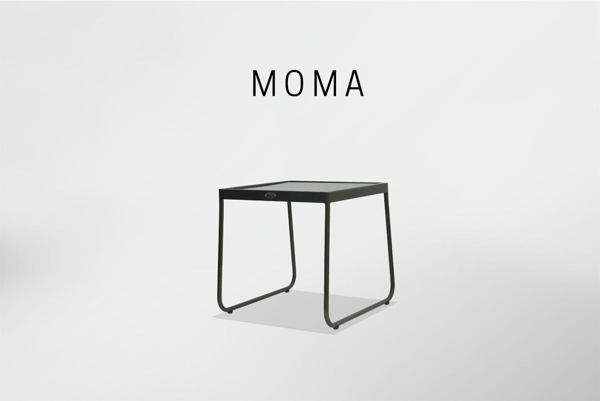 a black side table with a glass top