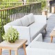 white wicker furniture on a deck