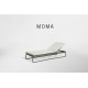 a lounge chair with the word moma on it