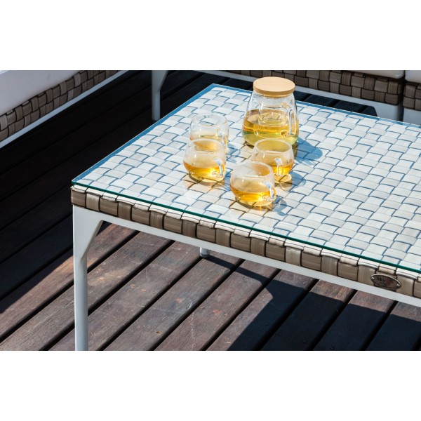 a glass table on a designer wooden terrace