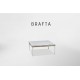 a white coffee table with a square top