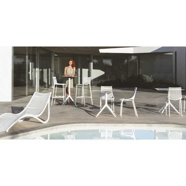 Woman on a terrace with deck chair and T-bar stools 74.5 cm indoor outdoor IBIZA Vondom