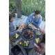 Convivialite autour de la table haute industrielle barbecue brasero MAGMA HIGH BOIS de VULX