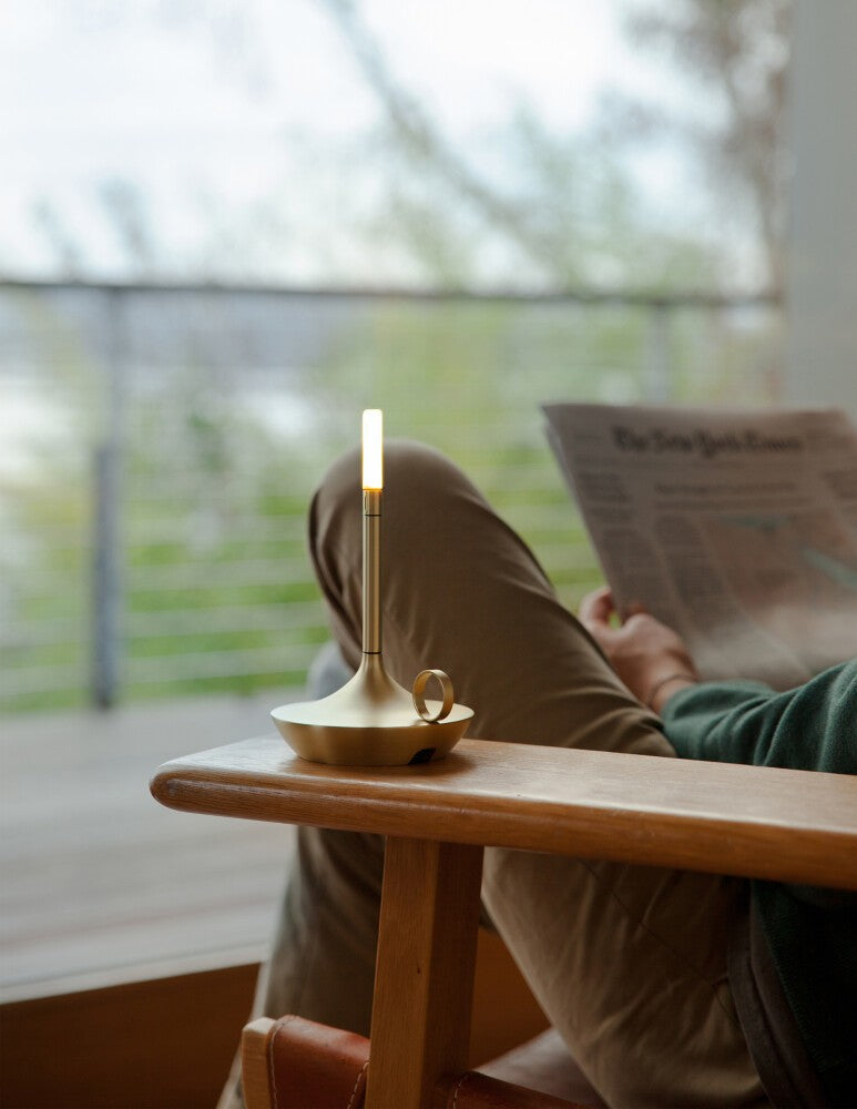 Wick S Pro Graypants table lamp placed on an armrest for reading