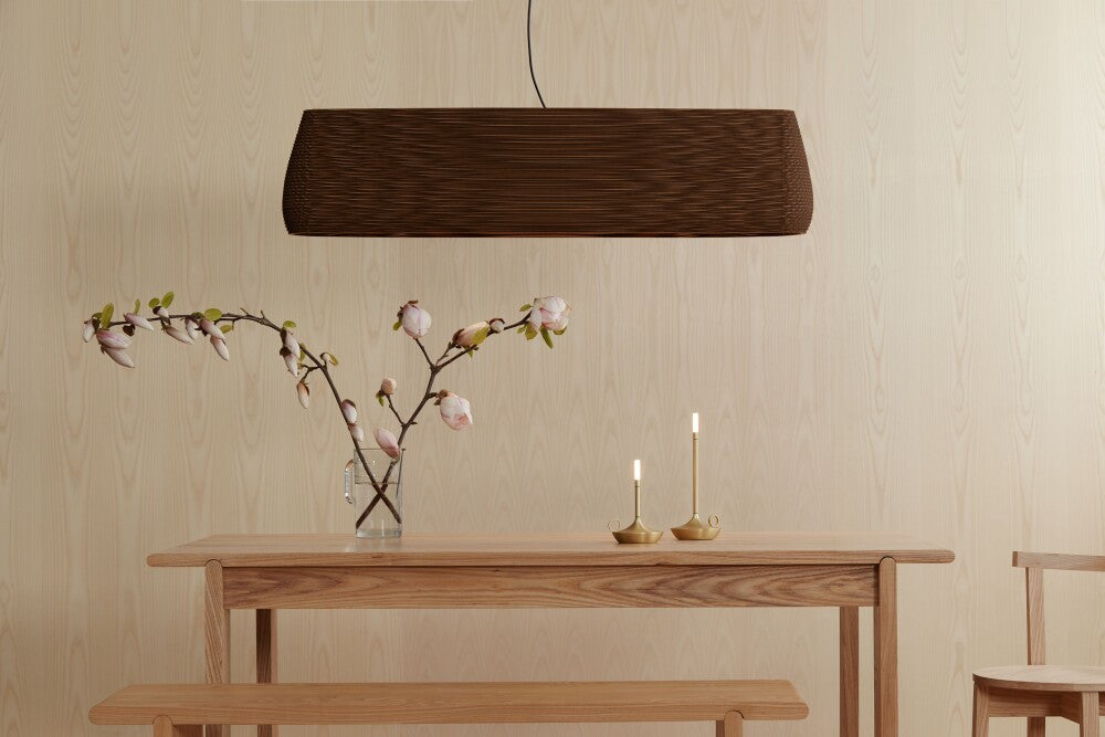 Wick S Pro and Wick Pro table lamps placed on a wooden table