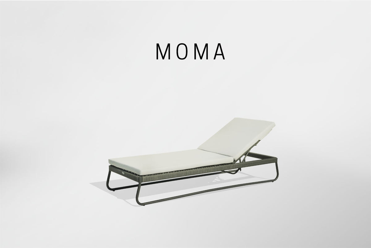 a lounge chair with the word moma on it